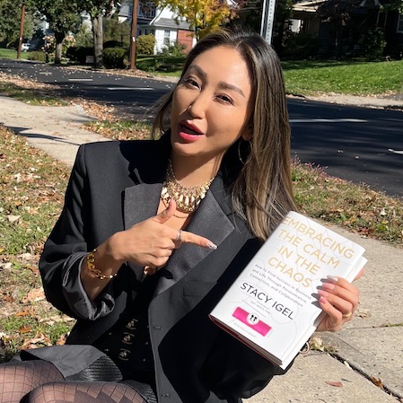 Michelle Park with a hardcover of "Embracing the Calm in the Chaos"