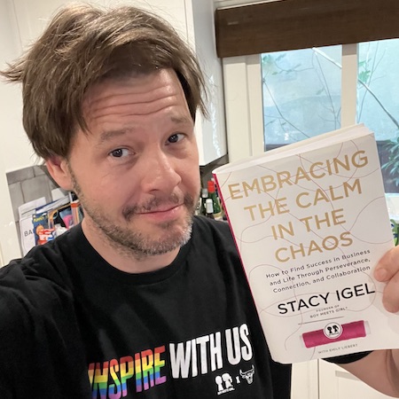 Ike Barinholtz with a hardcover of "Embracing the Calm in the Chaos"