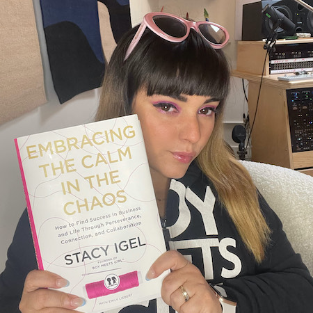 Jarina de Marco holding a hardcover of "Embracing the Calm in the Chaos"